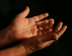 Two hands with dark background